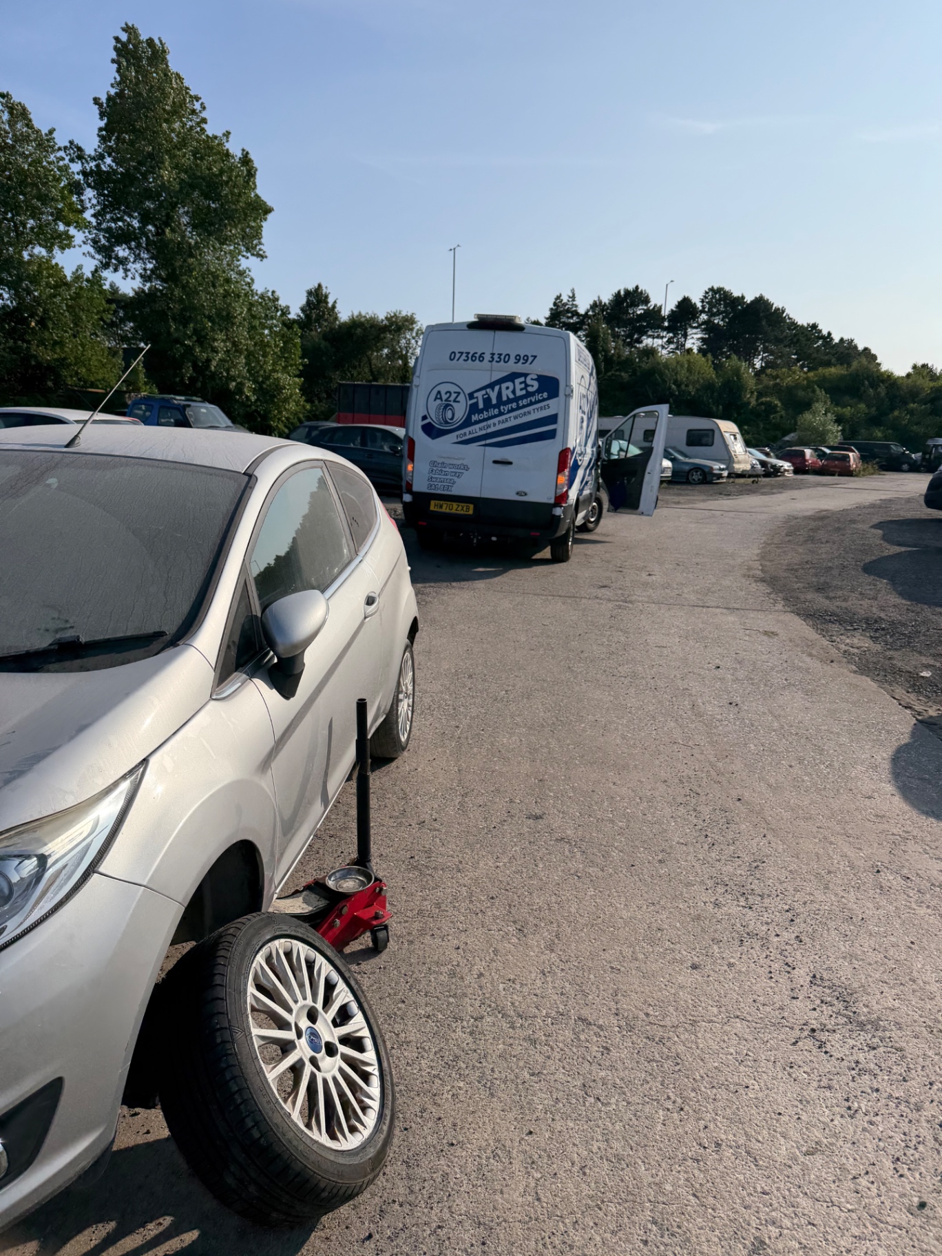 Rear of the A2Z van with tools out at a job